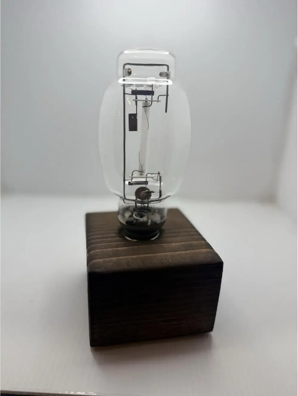 Vintage Retro High Pressure Sodium Industrial Bulb Display on Wood Pedestal